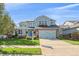 Charming two-story home with a well-manicured lawn and a two-car garage at 6317 Ruby Hill Dr, Erie, CO 80516