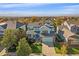 Inviting two-story home featuring manicured lawn, two car garage, and mountain views at 6317 Ruby Hill Dr, Erie, CO 80516
