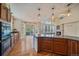 Well-lit kitchen with a kitchen island, stainless steel appliances, and hardwood floors throughout at 6317 Ruby Hill Dr, Erie, CO 80516