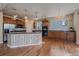 Kitchen with a center island, stainless steel appliances, and wood cabinets with granite countertops at 6317 Ruby Hill Dr, Erie, CO 80516