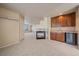 Inviting living area featuring a cozy fireplace and a convenient wet bar at 6317 Ruby Hill Dr, Erie, CO 80516