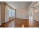 Inviting living room featuring hardwood floors, chandelier, and staircase views at 6317 Ruby Hill Dr, Erie, CO 80516