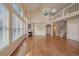 Bright living room showcasing fireplace, hardwood floors, and an adjacent staircase to the upper level at 6317 Ruby Hill Dr, Erie, CO 80516