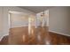 Open-concept living room with hardwood floors and staircase to the second floor at 6317 Ruby Hill Dr, Erie, CO 80516