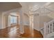 Sunlit living room with hardwood floors and staircase to the second floor at 6317 Ruby Hill Dr, Erie, CO 80516