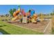 Community playground with slides, climbing structures, and soft landing surfacing at 6317 Ruby Hill Dr, Erie, CO 80516