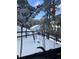 Idyllic backyard view with winter wonderland, featuring snow-covered outdoor seating and peaceful scenery at 13495 Shiloh Rd, Conifer, CO 80433
