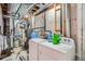 Utility area with washer, dryer, storage, utility sink and duct work at 13495 Shiloh Rd, Conifer, CO 80433