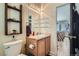 Cozy bathroom with modern toilet, wooden storage and a view to a sitting room at 13495 Shiloh Rd, Conifer, CO 80433