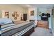 Comfortable bedroom with wooden dresser, art pieces, fireplace and a TV at 13495 Shiloh Rd, Conifer, CO 80433