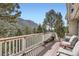 Enjoy stunning mountain views from this expansive deck, perfect for relaxation and outdoor living at 13495 Shiloh Rd, Conifer, CO 80433