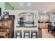 Eat-in kitchen with bar top, seamlessly connecting the kitchen to the dining and living space at 13495 Shiloh Rd, Conifer, CO 80433