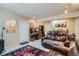 Cozy living room with a leather sofa, decorative rug, and ample space for relaxing or entertaining at 13495 Shiloh Rd, Conifer, CO 80433