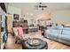Open-concept living space with hardwood floors seamlessly connects to the kitchen and dining areas at 13495 Shiloh Rd, Conifer, CO 80433