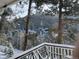 Breathtaking mountain view from the deck, showcasing a snow-covered landscape and serene natural beauty at 13495 Shiloh Rd, Conifer, CO 80433