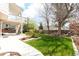 Well-maintained backyard featuring a lush lawn and mature trees at 18112 E Dorado Ave, Centennial, CO 80015