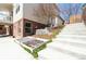 Back of house showing brick detail with a retaining wall and stairs to the back yard at 18112 E Dorado Ave, Centennial, CO 80015