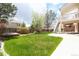 Large grassy backyard with a fire pit and multi-level deck at 18112 E Dorado Ave, Centennial, CO 80015