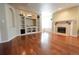 Finished basement area with a fireplace, hardwood floors and built in entertainment center at 18112 E Dorado Ave, Centennial, CO 80015