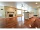 Finished basement area with a fireplace, hardwood floors, kitchen area and open layout at 18112 E Dorado Ave, Centennial, CO 80015