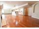 Finished basement area with a fireplace, hardwood floors, kitchen area and open layout at 18112 E Dorado Ave, Centennial, CO 80015