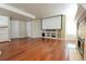 Finished basement area with a fireplace, hardwood floors and built in entertainment center at 18112 E Dorado Ave, Centennial, CO 80015