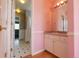 Charming bathroom with a sink vanity, ample storage and a view into the shower at 18112 E Dorado Ave, Centennial, CO 80015