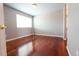 Bedroom with hardwood floors and an attached bathroom at 18112 E Dorado Ave, Centennial, CO 80015