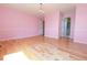 Spacious bedroom with hardwood floors, chandelier lighting and fresh, pink paint at 18112 E Dorado Ave, Centennial, CO 80015