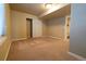 Carpeted bedroom area showing a sliding door closet and an ensuite bathroom at 18112 E Dorado Ave, Centennial, CO 80015