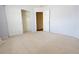 Bedroom with carpet floors, closet and attached bathroom through an open doorway at 18112 E Dorado Ave, Centennial, CO 80015