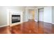 Bedroom features a fireplace, hardwood floors, and french doors leading to a bathroom at 18112 E Dorado Ave, Centennial, CO 80015