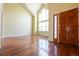 Inviting foyer with hardwood floors and a bright, high-ceiling window at 18112 E Dorado Ave, Centennial, CO 80015