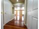 Hallway showing entrance to living area with hardwood flooring at 18112 E Dorado Ave, Centennial, CO 80015