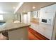 Bright kitchen features granite countertops, white cabinets, and modern microwave at 18112 E Dorado Ave, Centennial, CO 80015