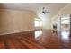 Large living room with fireplace, hardwood floors, high ceiling, and fan at 18112 E Dorado Ave, Centennial, CO 80015