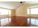 Bright living room featuring hardwood floors, and large windows providing great light at 18112 E Dorado Ave, Centennial, CO 80015
