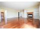 Large living room with hardwood floors, fireplace, and built-in bookshelves at 18112 E Dorado Ave, Centennial, CO 80015