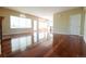 Bright living room with gleaming hardwood floors, fireplace, and large windows at 18112 E Dorado Ave, Centennial, CO 80015