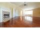 Open living space features a fireplace, hardwood floors and large windows at 18112 E Dorado Ave, Centennial, CO 80015