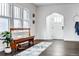 Inviting entryway with dark wood floors, stylish decor, and ample natural light at 171 S Pennsylvania St, Denver, CO 80209