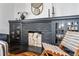 A close-up view of the decorative fireplace featuring built-in cabinetry and stylish decorations at 171 S Pennsylvania St, Denver, CO 80209