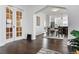 A view from the living room into the dining room, displaying an open floorplan with dark wood floors at 171 S Pennsylvania St, Denver, CO 80209