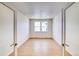 Bright, empty room featuring hardwood floors, neutral walls, and natural light from a window at 680 Tubman Dr, Elizabeth, CO 80107