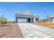 Single-Gathering home featuring an attached two-car garage and an inviting front entrance at 680 Tubman Dr, Elizabeth, CO 80107
