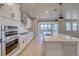 Well-equipped kitchen with stainless steel appliances, stone countertops, and custom cabinetry at 680 Tubman Dr, Elizabeth, CO 80107