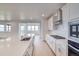 Bright kitchen boasts quartz countertops, stainless steel appliances, and an open floorplan at 680 Tubman Dr, Elizabeth, CO 80107