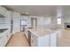 Open kitchen with a large island, stainless steel appliances, and hardwood floors at 680 Tubman Dr, Elizabeth, CO 80107