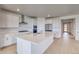Modern kitchen with white cabinetry, stainless steel appliances, and quartz countertops at 680 Tubman Dr, Elizabeth, CO 80107