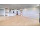 Open-concept living space with hardwood floors, a modern kitchen, and a staircase at 680 Tubman Dr, Elizabeth, CO 80107